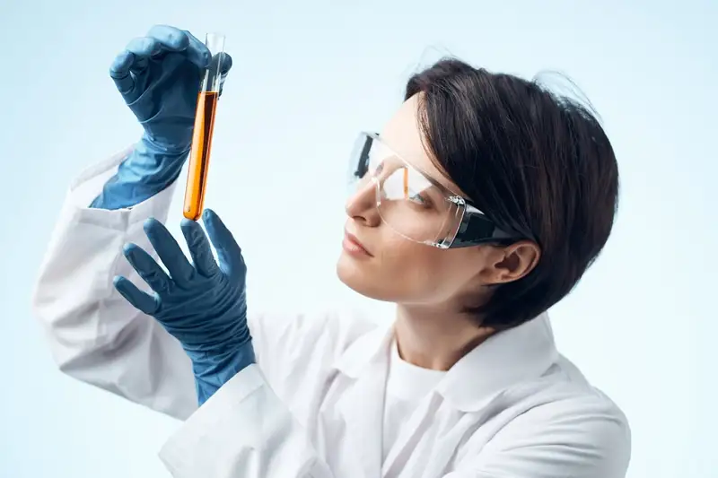 Scientist examining test tube
